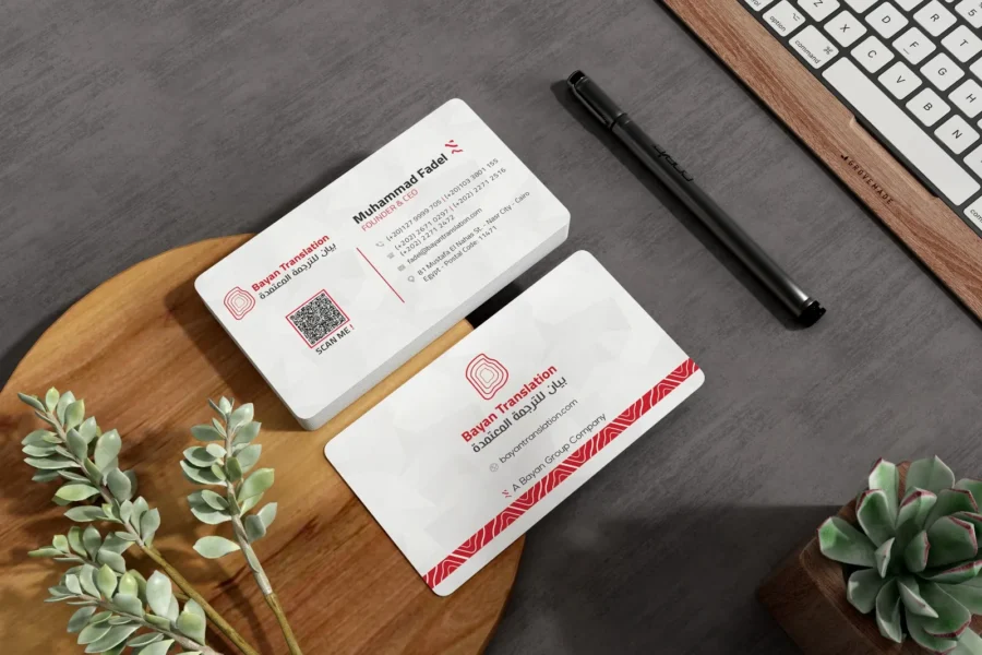 Bayan Translation business cards on a wooden desk