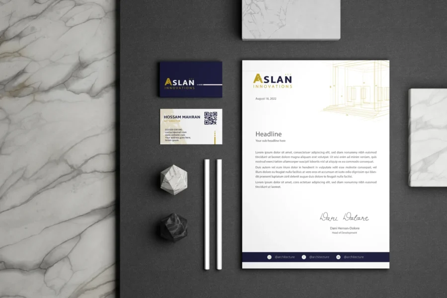 ASLAN Innovations letterhead and business cards on marble